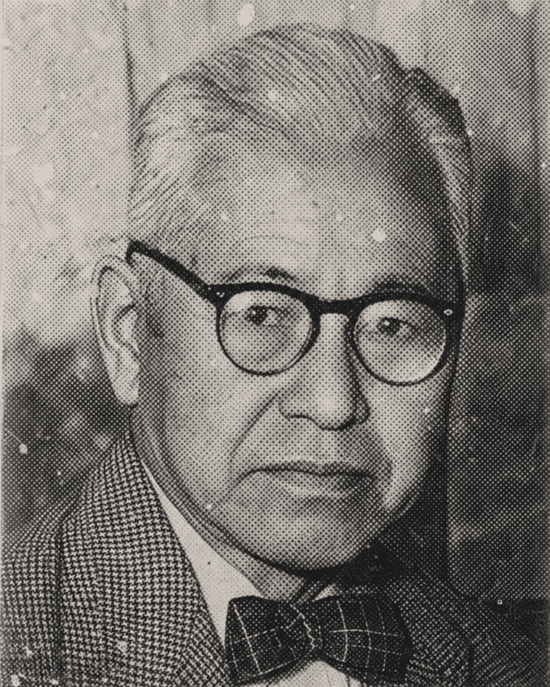 Wada Sanzō in his later years — round glasses, bow tie and houndstooth jacket, in a halftone print reproduction